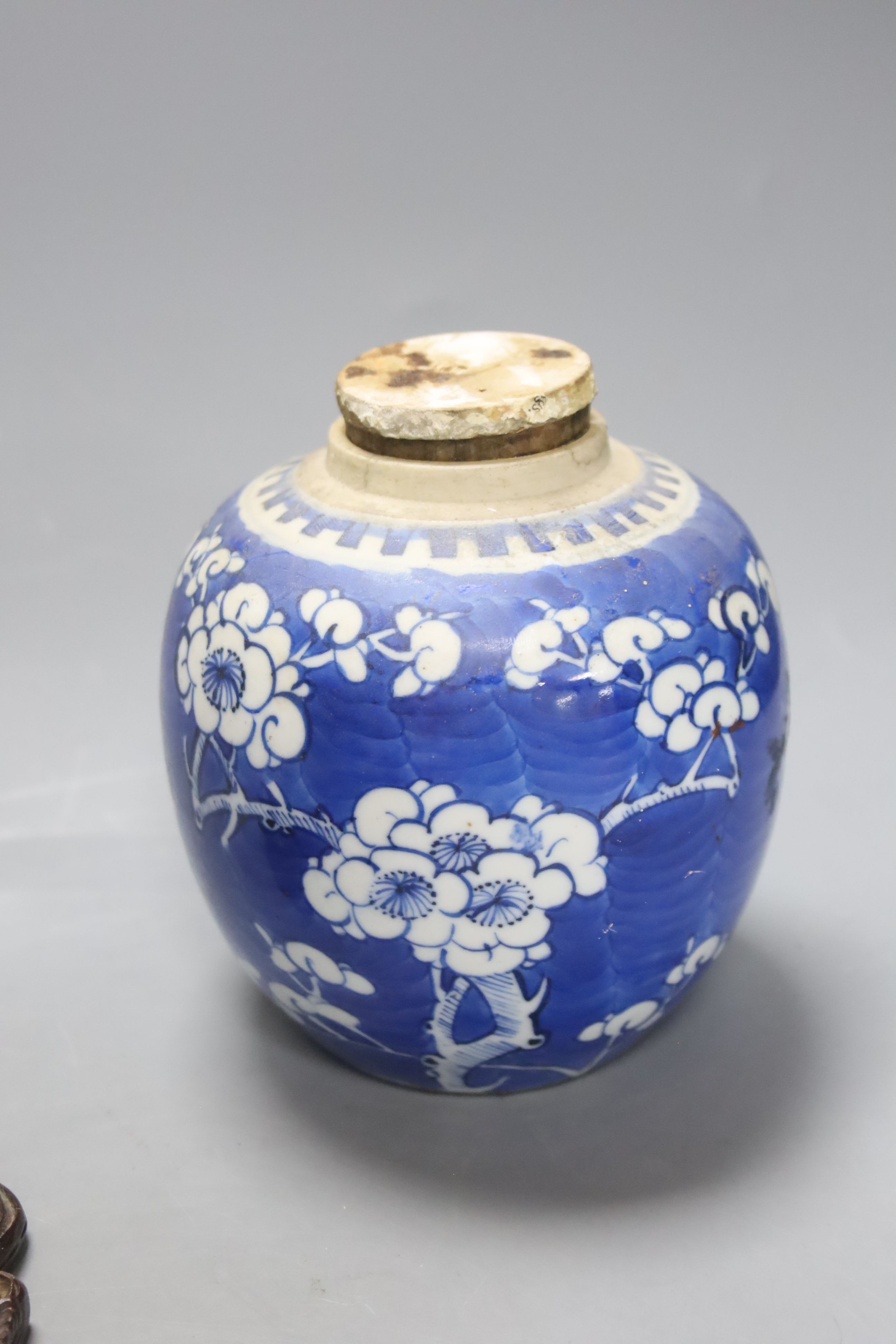 Two early 20th century Chinese blue and white jars, an agate miniature teapot and an Indonesian wood carving, length 27.5cm